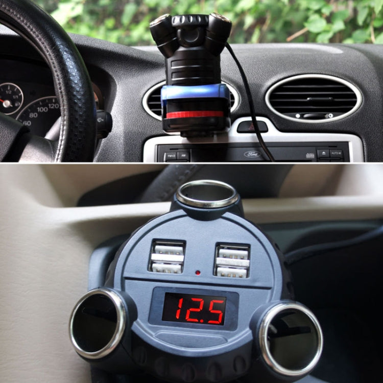 Silver-and-black 4-port USB car charger plugged in with LED voltage readout