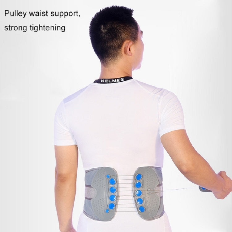 Black lumbar support belt with disc pads on back, worn over a shirt