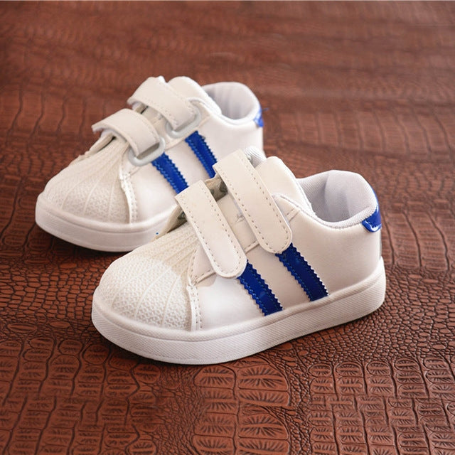 Children's white casual sneakers with blue striped velcro straps