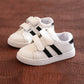 Children's white casual sneakers with black striped velcro straps