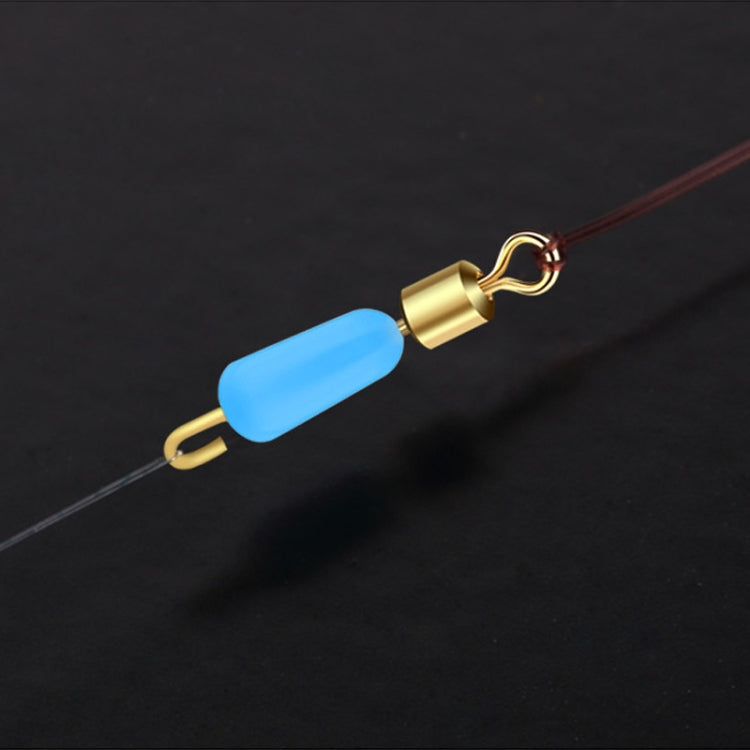 Silicone eight-shaped ring connector attached to fishing line with gold cap and blue bead