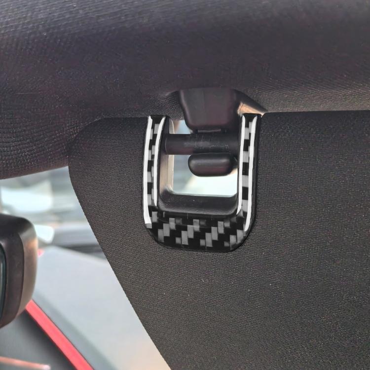 Close-up of a U-shaped carbon-fiber sun visor trim sticker with white edge on handle