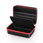 Black storage bag opened with red piping and zippered divider, compact organizer case