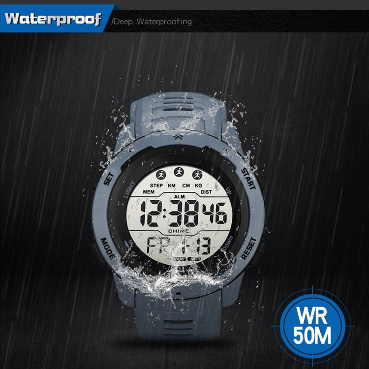 Grey digital running watch with large LCD display showing time with water splash
