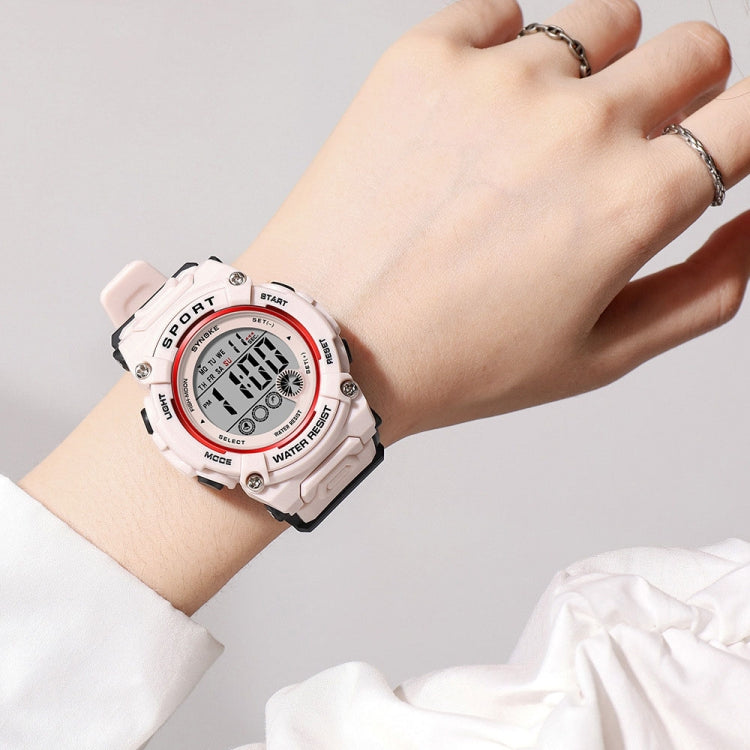 Pink sports watch worn on wrist, round digital display with buttons