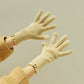 Wool knit winter gloves in light yellow, ribbed cuffs with full five-finger design