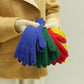 Wool knit winter gloves set in blue, green, yellow, and red stacked together