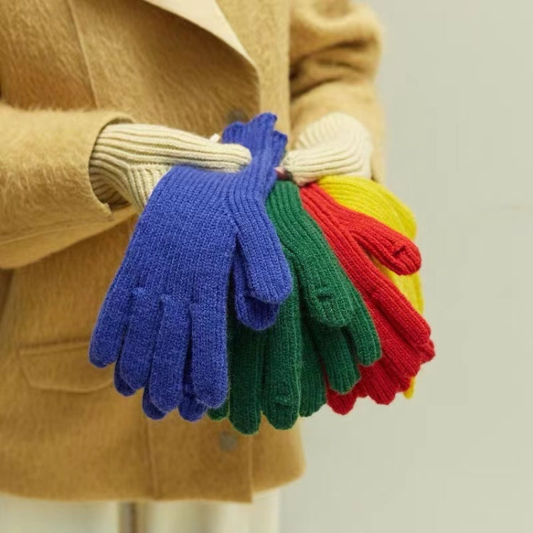 Wool knit winter gloves set in blue, green, yellow, and red stacked together