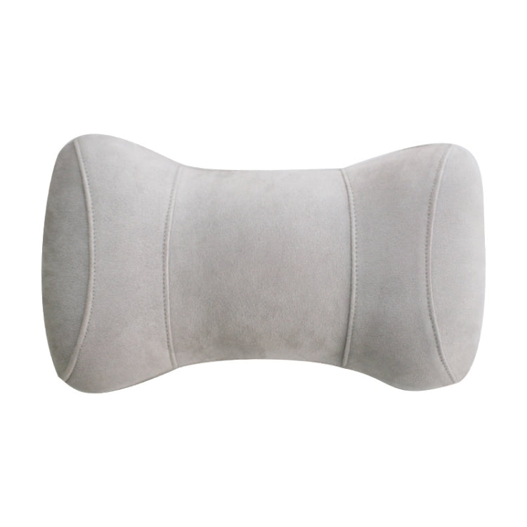 Light gray memory foam neck pillow with curved headrest support and stitched seams