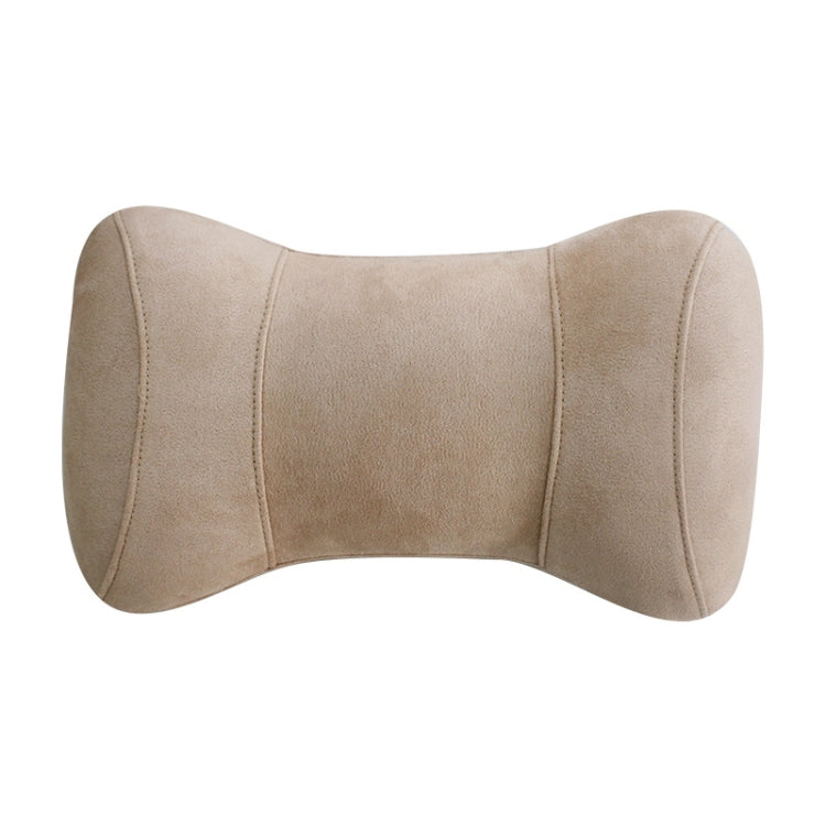 Beige memory foam neck pillow with curved headrest support and stitched seams