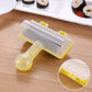 Handheld sushi roll maker tool with yellow handle and clear textured press, shown in use