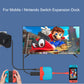 Portable expansion dock setup with connected phone and Nintendo Switch-style display via cables