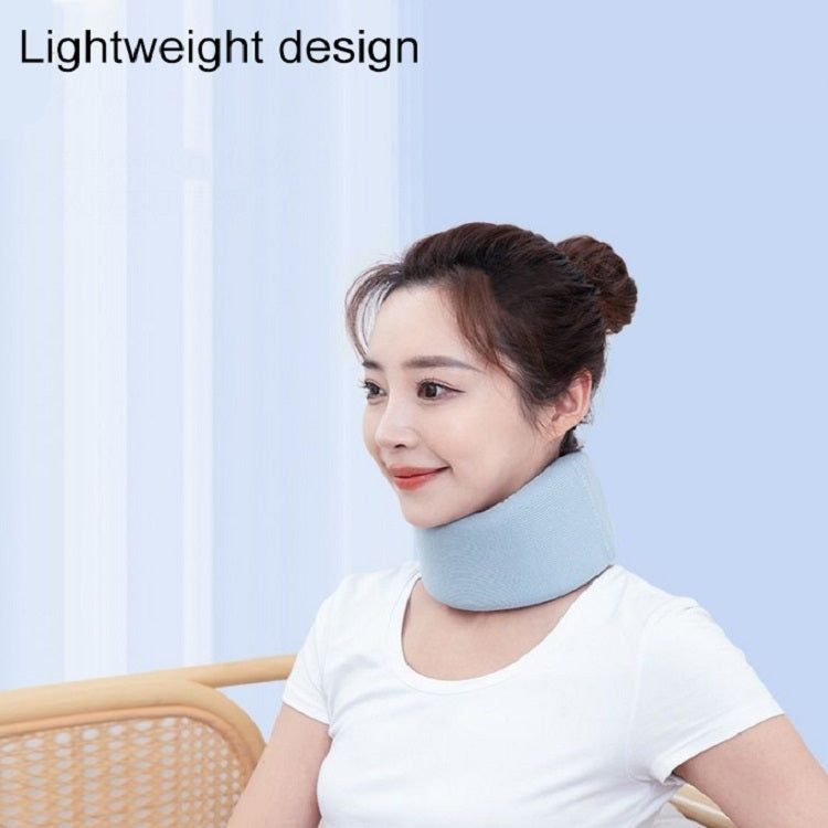 Light blue neck brace ring worn around the neck, seated side view
