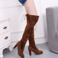 Brown suede over-the-knee boot pair with slim high heel and lace tie