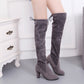 Gray over-the-knee lace-up boots with tall heel and thick construction