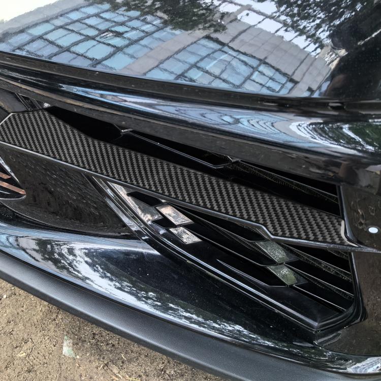 Installed carbon-fiber front vent sticker strip on grille vent surround
