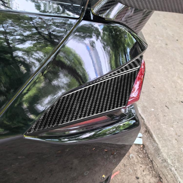 Applied carbon-fiber taillight accent stickers on rear corner, Corvette C8