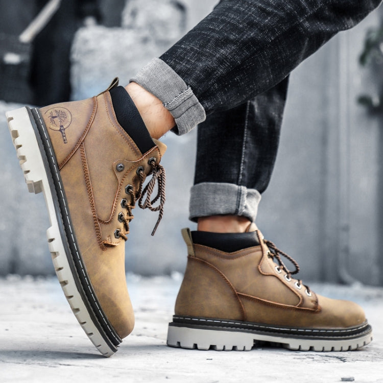 Tan lace-up winter work boots with black ankle collar and tread sole