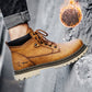Tan lace-up winter work boot with black collar trim and chunky tread sole