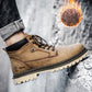 Tan lace-up work boot with padded collar, stitched overlays, and rugged treaded sole