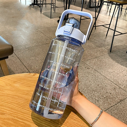 Purple outdoor sports water bottle with flip spout and straw, printed time text