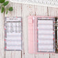 Budget sheet pages in binder rings, pink patterned cover with lined inserts and tabs