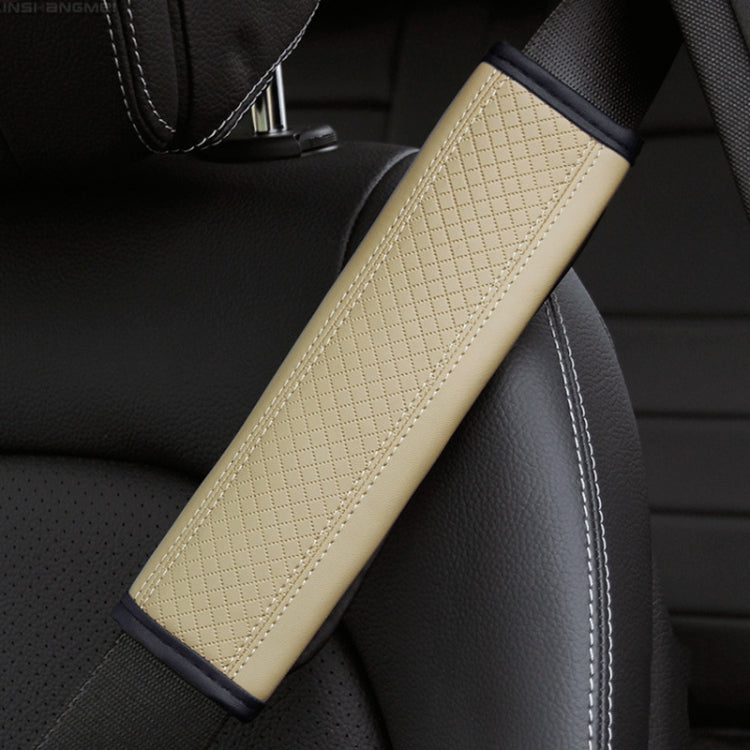 Car seat belt shoulder cover protector in beige textured leather with white edge stitching