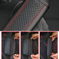 Black embossed leather seat belt shoulder cover with red stitching, 6.5x23cm
