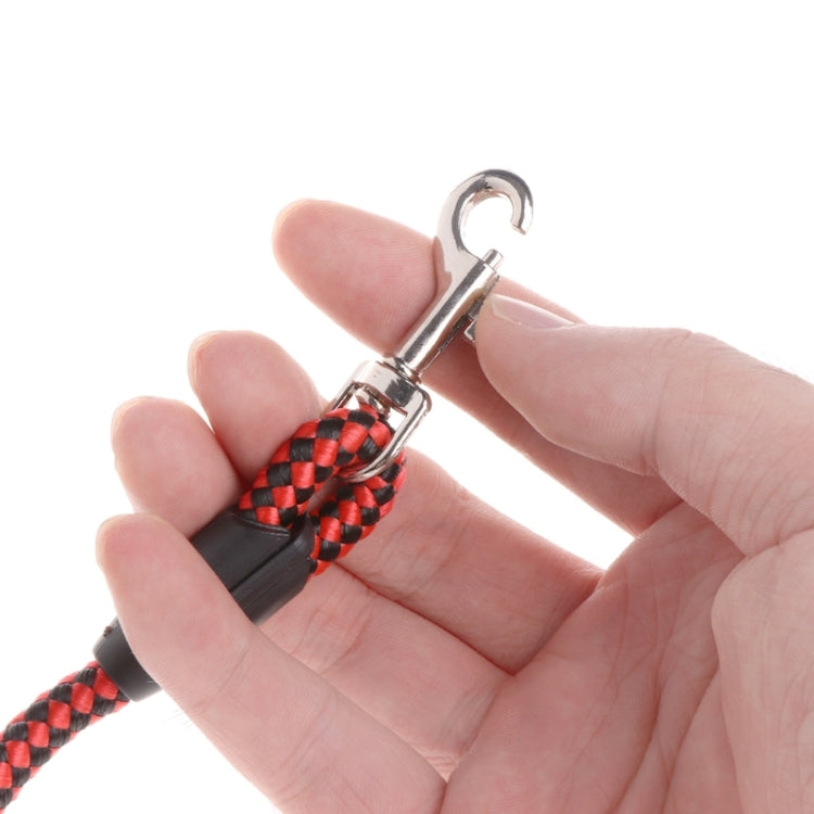 Red-and-black braided leash rope ring, shown held in a hand