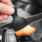 Car seat console cleaning brush with black handle and orange bristle head