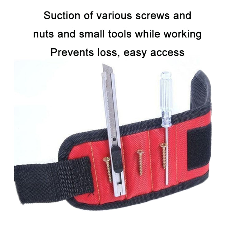 Red magnetic wrist strap holding small metal screws and tools on the band
