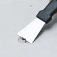 Straight-blade scraper tool removing debris from a flat surface