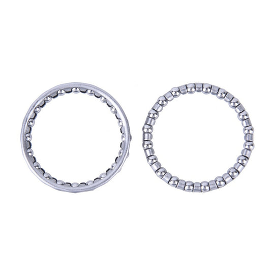 Two circular roller bearing rings with shiny metal balls