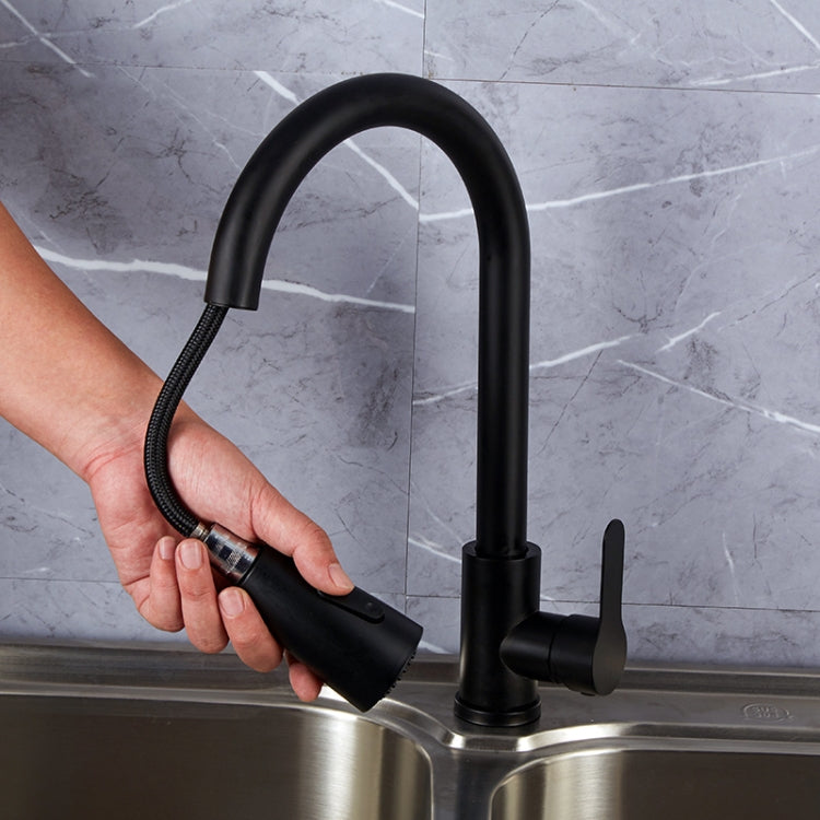 Black pull-out kitchen faucet with handheld sprayer, flexible hose and curved spout