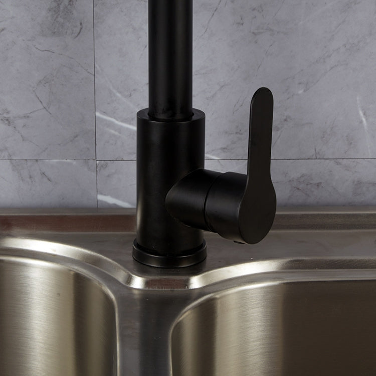 Black pull-out kitchen faucet with lever handle and spout mounted over stainless sink