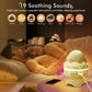 LED dinosaur egg night light glowing on bedside on a pillow