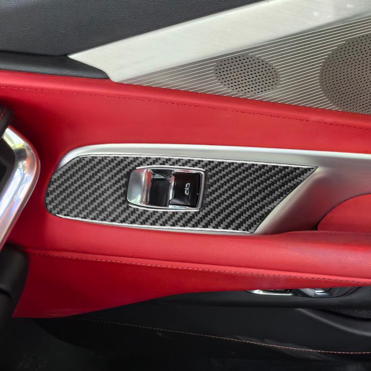 Installed carbon-fiber-pattern bezel sticker around lift button switches in car interior