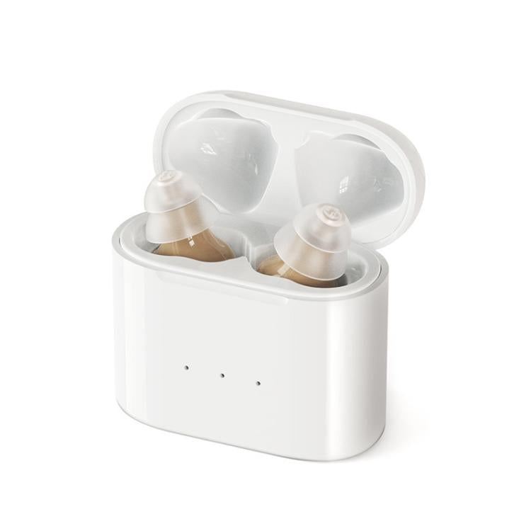 White charging case open with two CIC hearing aids in skin-tone