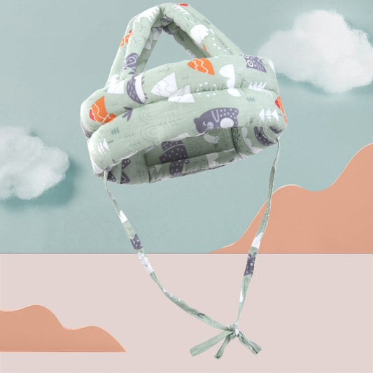 Breathable protective baby head cap with green forest and animal prints, tied chin straps