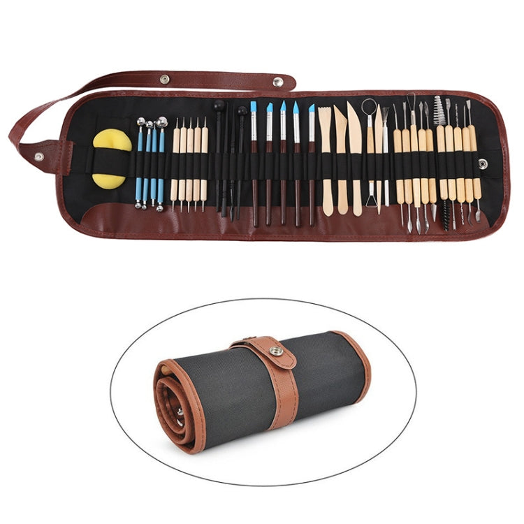 Clay carving tool set laid out in a brown fabric roll, assorted sculpting tips