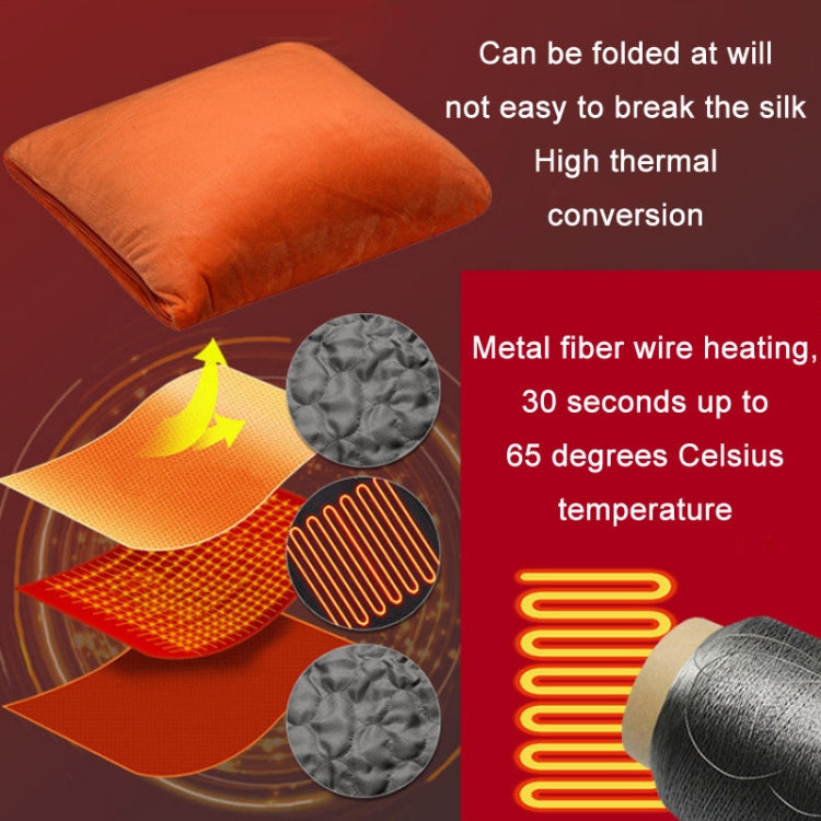 Orange electric heating blanket/pillow with glowing heating coils and quilted fabric