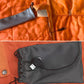 Electric heating blanket with orange-and-gray fabric, drawstring pouch, and small controller
