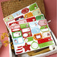 Christmas sticker sheets in a stack with assorted label and tag designs