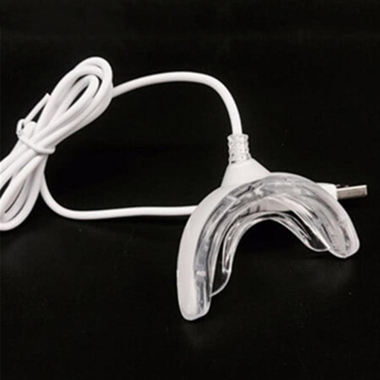 Clear silicone mouth tray with white power cable and plug