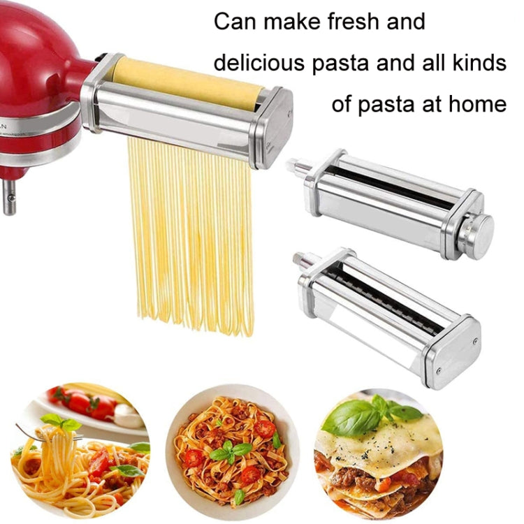 Noodle pressing attachment with yellow spaghetti strands and stainless steel die rollers