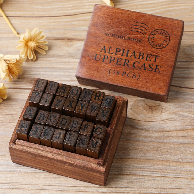 Wooden alphabet and number stamp set in open box, uppercase and lowercase letters
