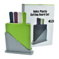 4-piece plastic cutting board set in box with four color boards on a gray stand