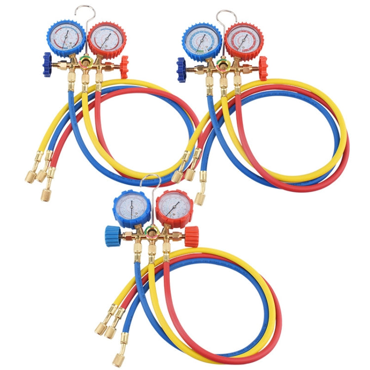Set of AC refrigeration double meter valves with blue/red gauges and color-coded hoses