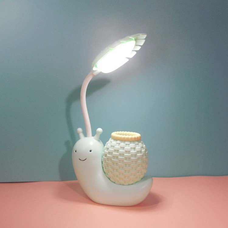 Cartoon snail LED desk lamp with woven cup shade and warm light, white/cream body