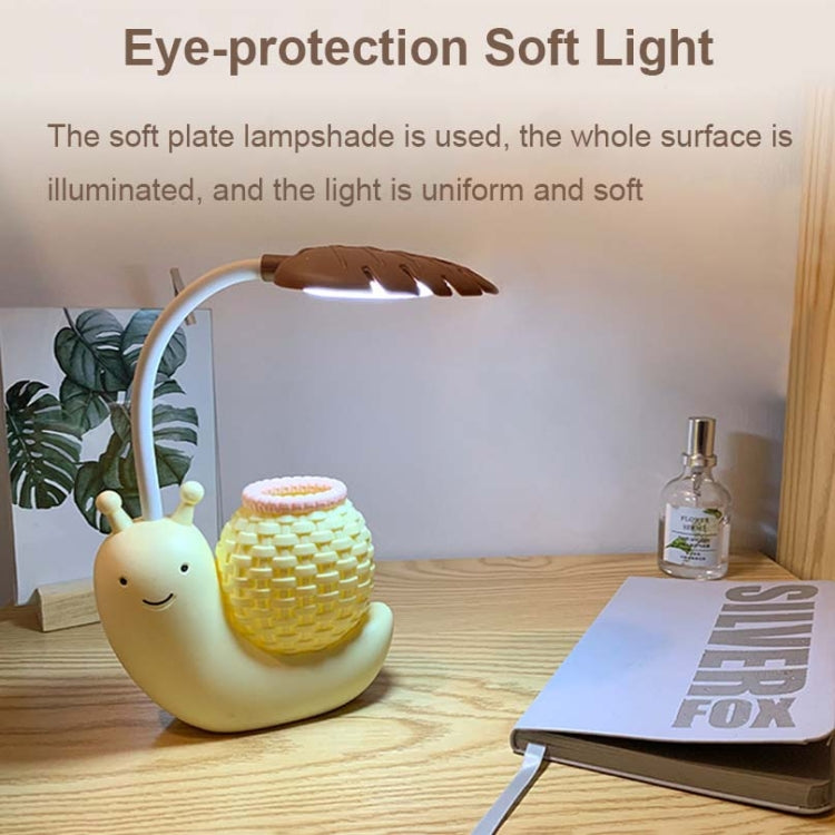 Cartoon snail LED desk lamp with soft illuminated shade, yellow body